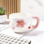 مج البورسلين الوردي 300 مل – تصميم زهور وكرز مبهج للاستخدام اليومي والهدايا