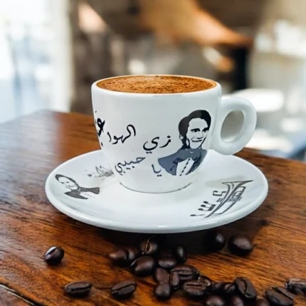 فنجان قهوة عبد الحليم حافظ بورسلين 90 مل – تصميم كوبليه “زي الهوا” – أبيض × أسود – شكل بيضاوي أنيق