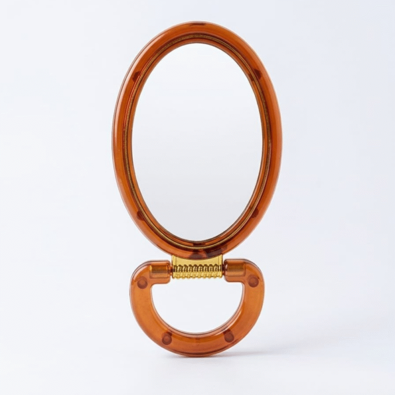 مراية عسلي بيضاوية 16×8 سم – مرآة يد أنيقة بتصميم كلاسيكي لون عسلي شفاف