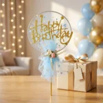 ⁦توبر كيك Happy Birthday ذهبي بطول 21 سم مع تول أزرق – زينة عيد ميلاد فخمة للكيك⁩ - الصورة ⁦4⁩