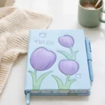 ⁦نوت بوك هارد كوفر بتصميم زهور التوليب – مقاس 21×14 سم – دفتر أنيق للمذاكرة وتدوين الملاحظات⁩ - الصورة ⁦6⁩
