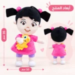 ⁦دبدوب بو بفستان بينك وشعر أسود بضفيرتين ومعاها لعبة صفراء – مقاس 35×10 سم⁩ - الصورة ⁦2⁩